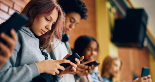 Students communicating with their phones during education hours